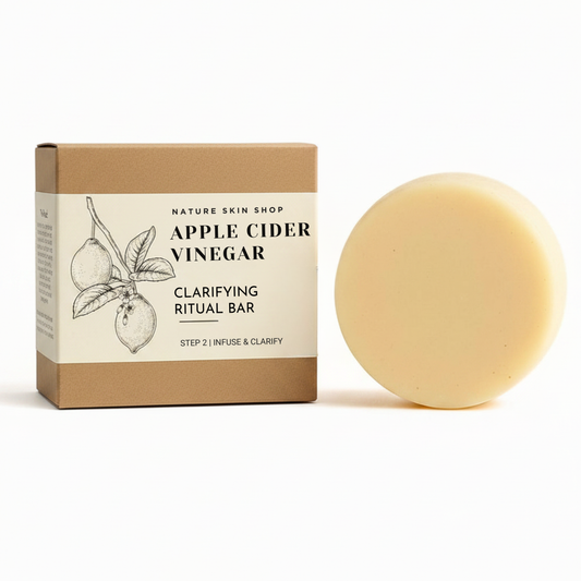 Bar of soap next to its packaging with 'Apple Cider Vinegar' text on a white background