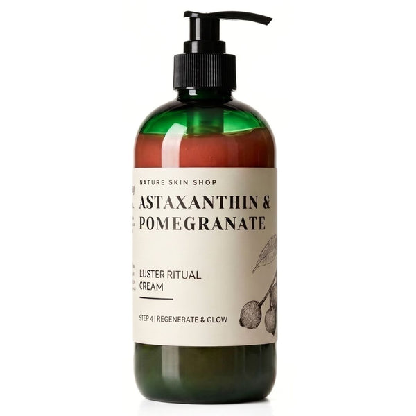 A pump bottle of Nature Skin Shop Mastaxanthin & Pomegranate Luster Ritual Cream, featuring a dark green translucent bottle, amber-brown liquid inside, and a cream-colored label with black text.