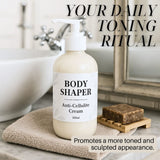 Body Shaper anti-cellulite cream bottle on a bathroom counter with text overlay. Body Shaper anti-cellulite cream bottle on a bathroom counter with text overlay.