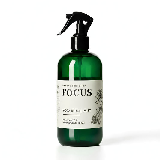 Green spray bottle labeled 'Focus Yoga Ritual Mist' on a white background