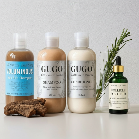 Set of GUGO shampoo, conditioner, and Follicle Fortifier with a plant on a white surface.