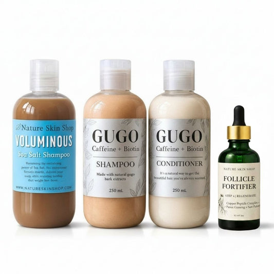 Set of hair care products including shampoo, conditioner, and serum on a white background