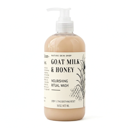 A 16 oz pump bottle of Nature Skin Shop Goat Milk & Honey Nourishing Ritual Wash, filled with a light beige liquid and featuring a cream-colored label with black text and botanical illustrations.