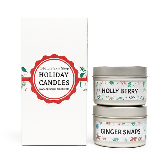 Two holiday candles labeled 'Holly Berry' and 'Ginger Snaps' with a branded box on a white background.