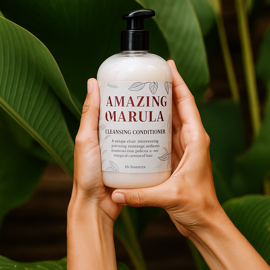 Hand holding a bottle of 'Amazing Marula' cleansing conditioner with green leaves in the background