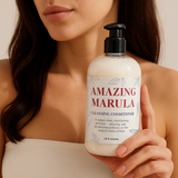 Woman holding a bottle of 'Amazing Marula' cleansing conditioner. Woman holding a bottle of 'Amazing Marula' cleansing conditioner.