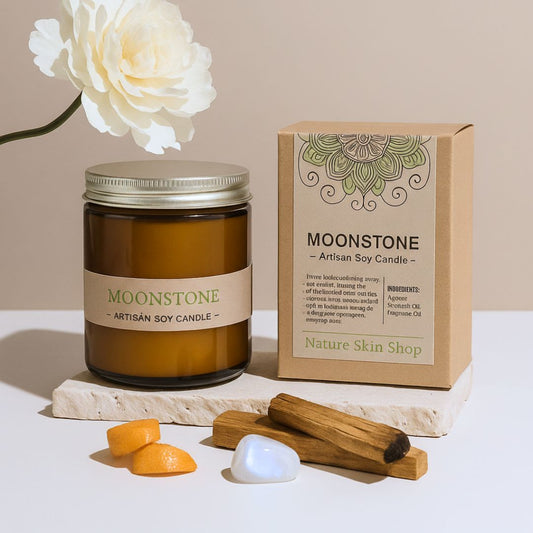Moonstone artisan soy candle with packaging and natural items on a light background