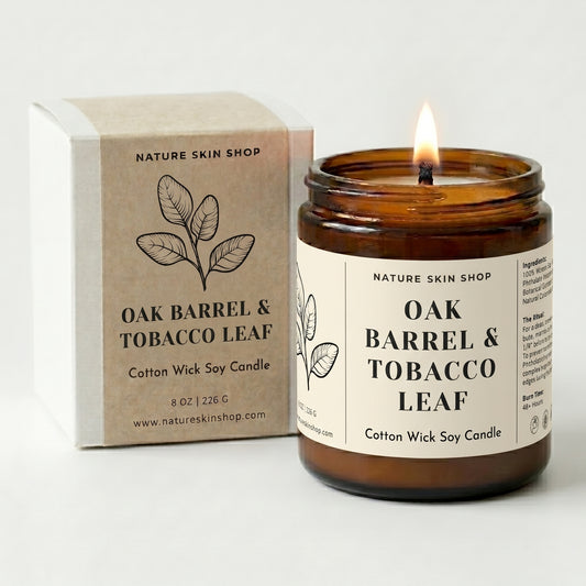 Candle labeled 'Oak Barrel & Tobacco Leaf' from Nature Skin Shop with packaging on a white background