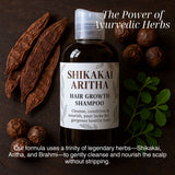 Shikakai Aritha hair growth shampoo bottle with herbs on a dark background Shikakai Aritha hair growth shampoo bottle with herbs on a dark background