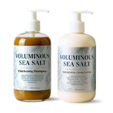 Two bottles of Voluminous Sea Salt thickening shampoo and conditioner on a white background Two bottles of Voluminous Sea Salt thickening shampoo and conditioner on a white background