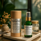 Bakuchiol nature's elixir serum bottles on a marble tray with a blurred natural background