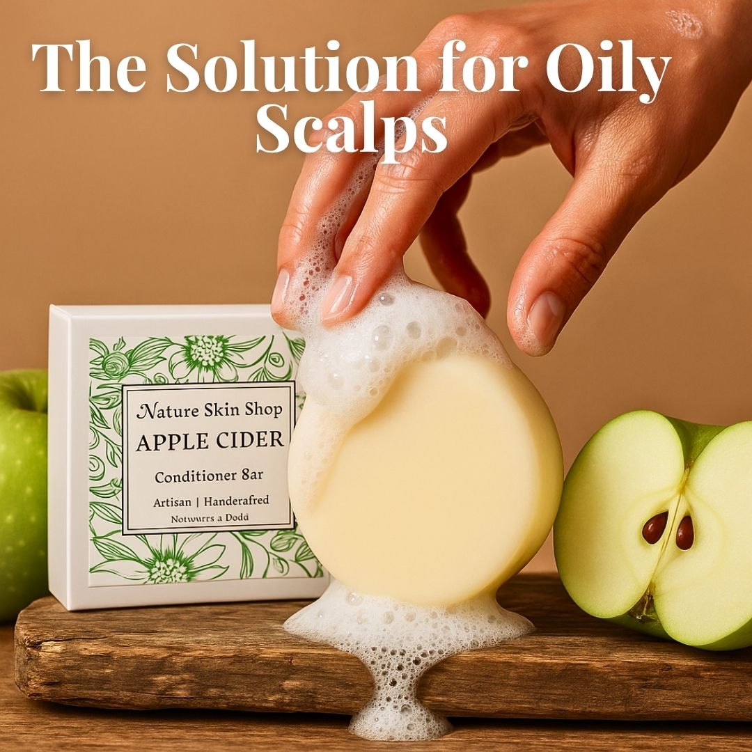 Bar of soap with foam, hand holding it, and 'Nature Skin Shop Apple Cider' conditioner bar with apples on a wooden surface.