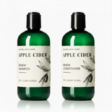 Two bottles of Apple Cider Renew Shampoo and Conditioner from Nature Skin Shop on a white background