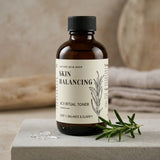 Bottle of 'Skin Balancing' toner with a label on a neutral background