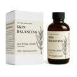 Skin balancing toner bottle and packaging with branding on a white background