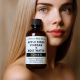 Bottle of Apple Cider Vinegar + Rose Water Toner held by a woman with a neutral background