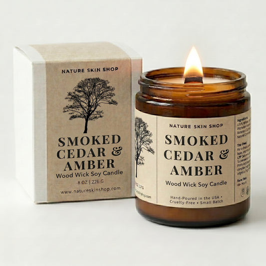 Smoked Cedar & Amber candle from Nature Skin Shop with packaging on a white background