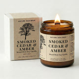 Smoked Cedar & Amber candle from Nature Skin Shop with packaging on a white background