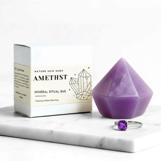 Amethyst mineral ritual bar with packaging and ring on a white marble surface