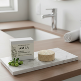 Amla soap bar and packaging on a marble tray in a bathroom setting