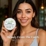 Woman holding an Amla Avurvedic Shampoo Bar with a blurred background