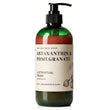 A pump bottle of Nature Skin Shop Mastaxanthin & Pomegranate Luster Ritual Cream, featuring a dark green translucent bottle, amber-brown liquid inside, and a cream-colored label with black text.
