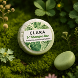 Clara 2-in-1 Shampoo Bar on a green background with plants