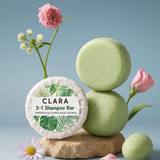 Green shampoo bars with a CLARA label and flowers on a light blue background