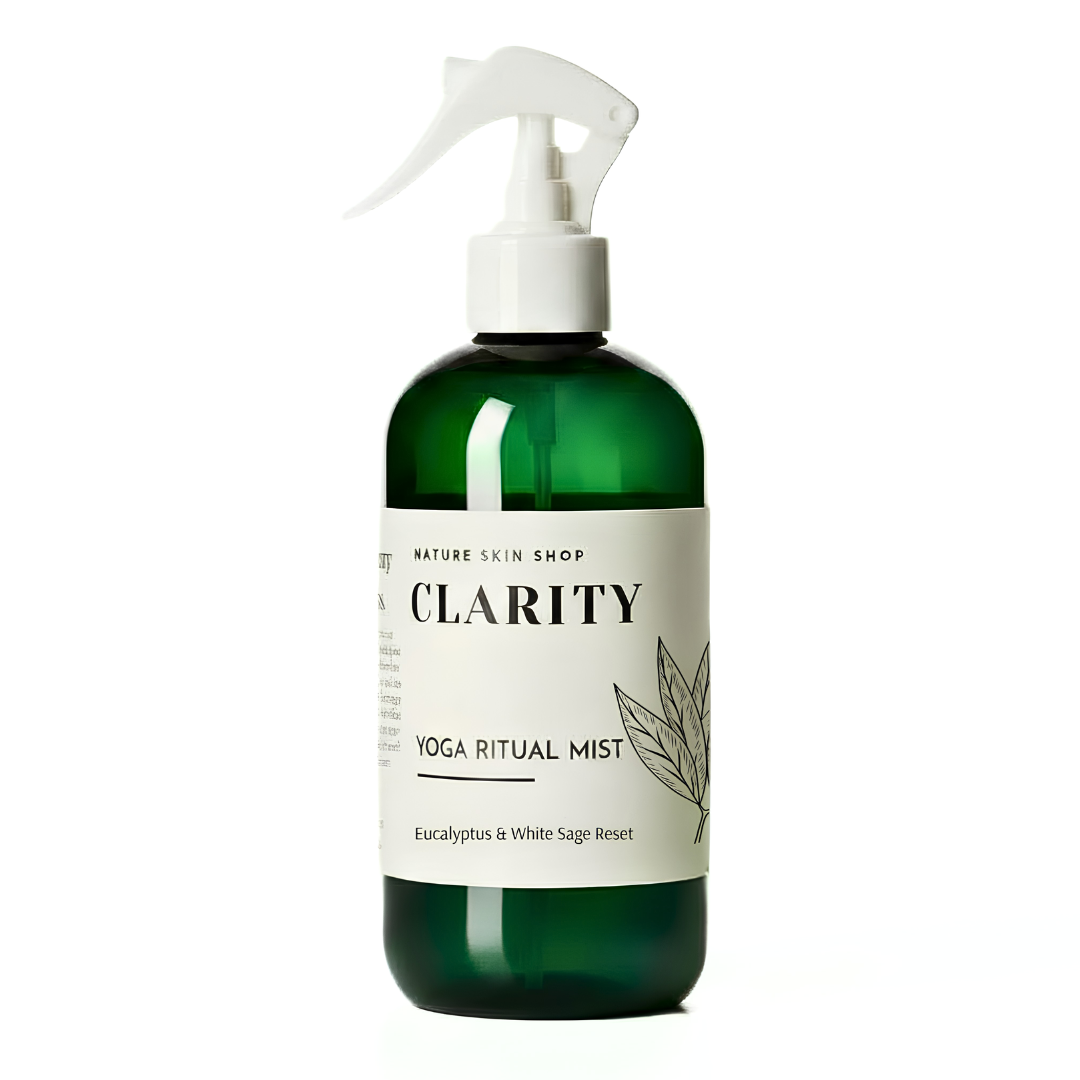 Green bottle with white spray nozzle labeled 'Clarity' on a white background