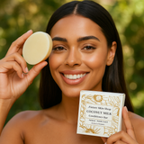 Woman holding a coconut milk conditioner bar and its packaging with a green blurred background