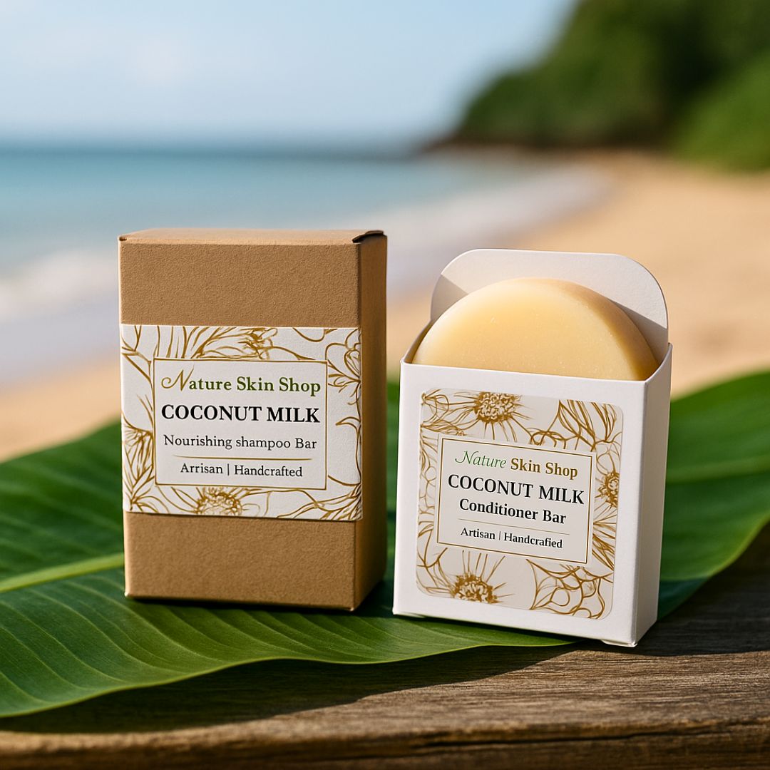Coconut milk shampoo and conditioner bars from Nature Skin Shop on a leaf with a beach background
