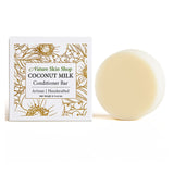 Coconut milk conditioner bar with packaging from Nature Skin Shop on a white background