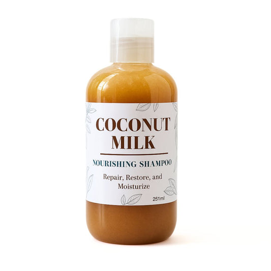 Bottle of coconut milk shampoo with a label on a white background