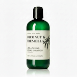Green shampoo bottle with label on a white background