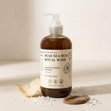Bottle of Dead Sea Mud Ritual Wash with a label on a neutral background