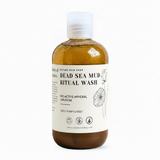Bottle of Dead Sea Mud Ritual Wash with a white label on a white background