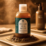 Bottle of Dead Sea Mud with a label on a wooden surface