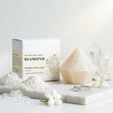 Diamond mineral ritual bar with packaging, crystals, and a ring on a white surface