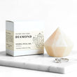 Diamond mineral ritual bar with packaging and a ring on a marble surface