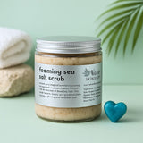 Jar of foaming sea salt scrub with a heart-shaped object on a light green background