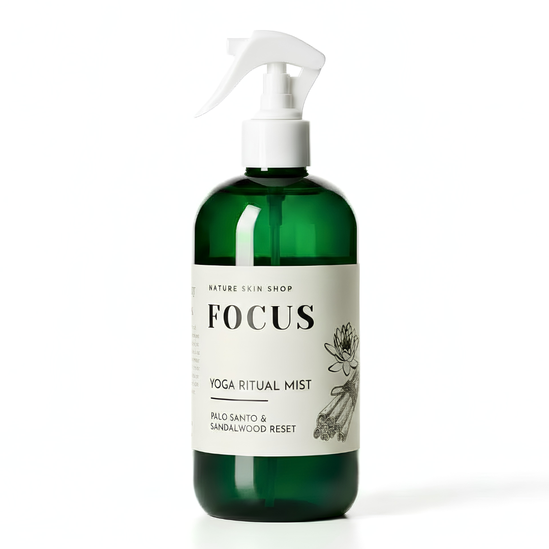 Green bottle of 'Focus' yoga ritual mist with a white label on a white background