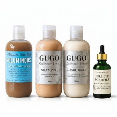 Set of hair care products including shampoo, conditioner, and serum on a white background