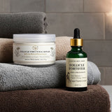 Cosmetic jar and dropper bottle labeled 'Follicle Fortifier' on stacked towels with a neutral background.