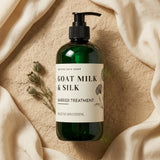 Bottle of Goat Milk & Silk Barrier Treatment on a beige fabric background