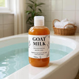 Bottle of goat milk bath gel on the edge of a bathtub with a bathroom setting in the background.