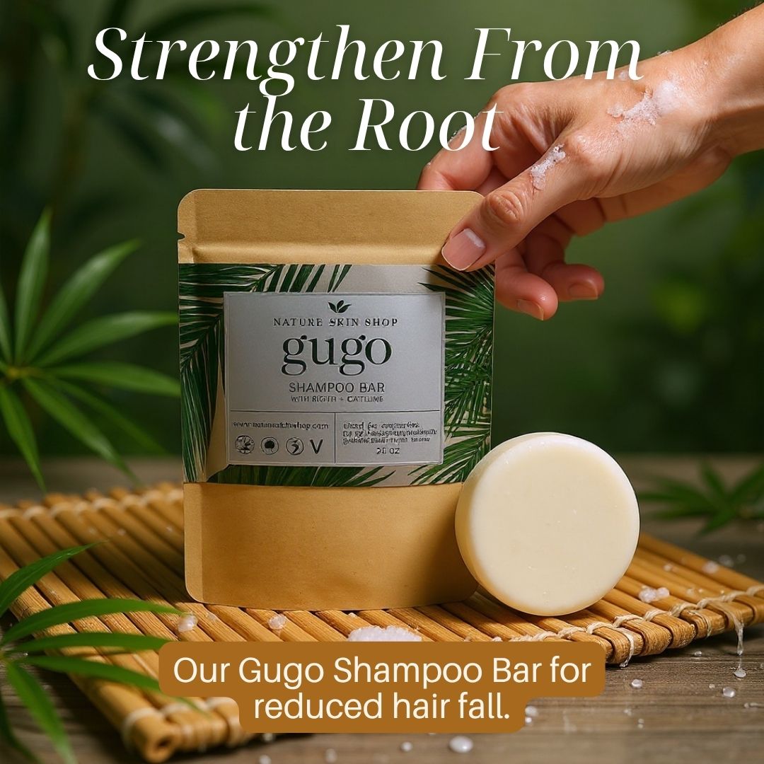 Gugo shampoo bar with packaging on a wooden mat, surrounded by greenery.