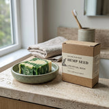 Hemp Seed Lipid Ritual Wash soap bar and packaging on a windowsill