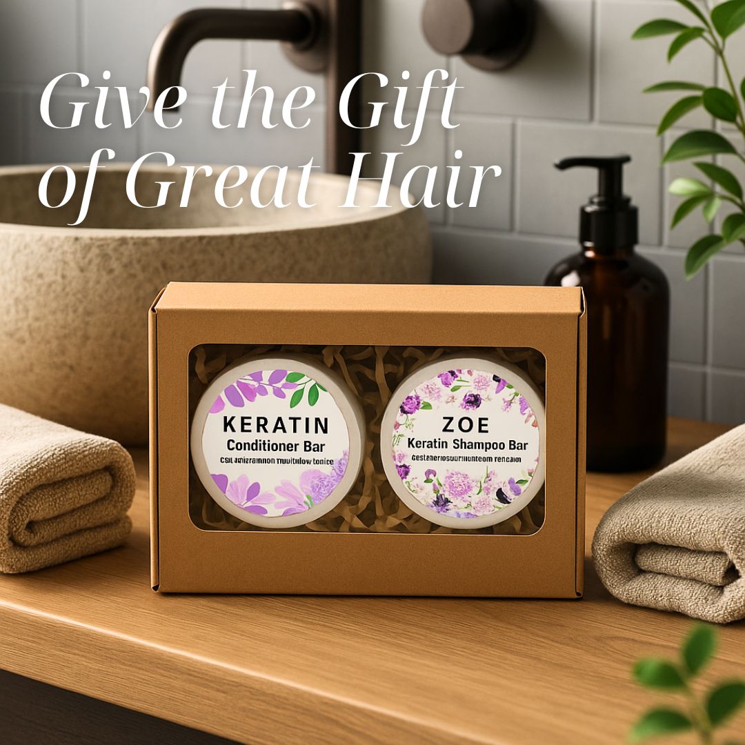 Keratin shampoo and conditioner bars in a box on a bathroom counter with text 'Give the Gift of Great Hair'.