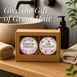 Keratin shampoo and conditioner bars in a box on a bathroom counter with text 'Give the Gift of Great Hair'.