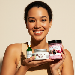 Woman holding skincare products with a beige background